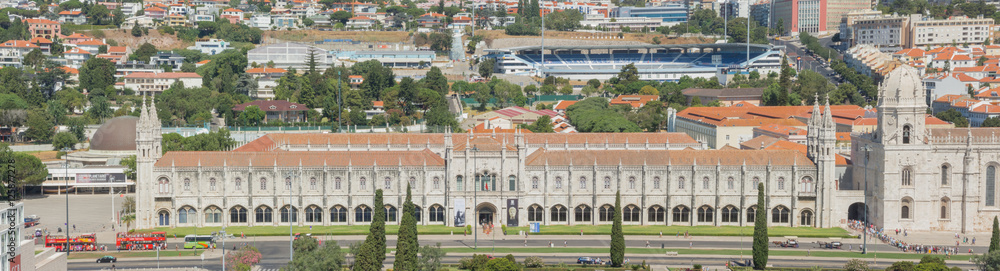 Obraz premium Lisbon, Portugal, September 10, 2016. Landscape from the Monument to the Discoveries (named Padrao dos Descobrimentos) to the Belem tower, Tagus river, 25 de Abril Bridge and Monastery named Jeronimos