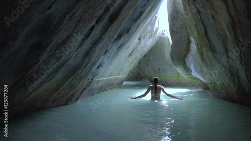 Woman relaxing in the water at the Baths, Virgin Gorda, British Virgin Islands