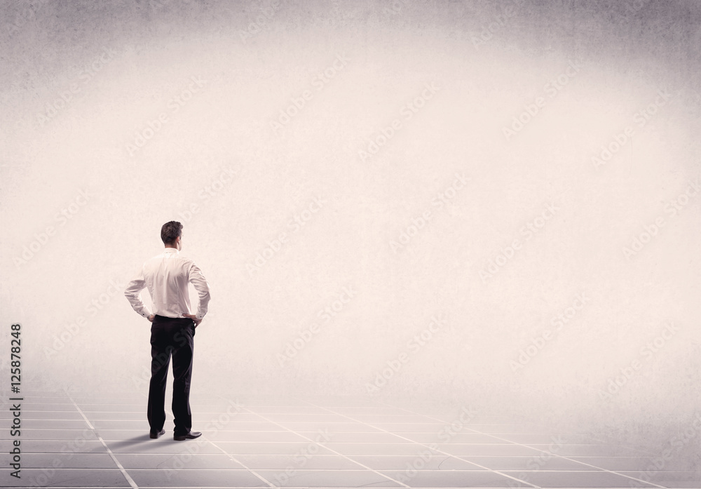 Business person standing in empty space Business person standing in empty space