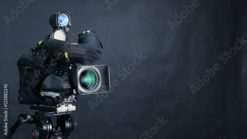 Studio broadcasting camera isolated on black background. 4K. photo