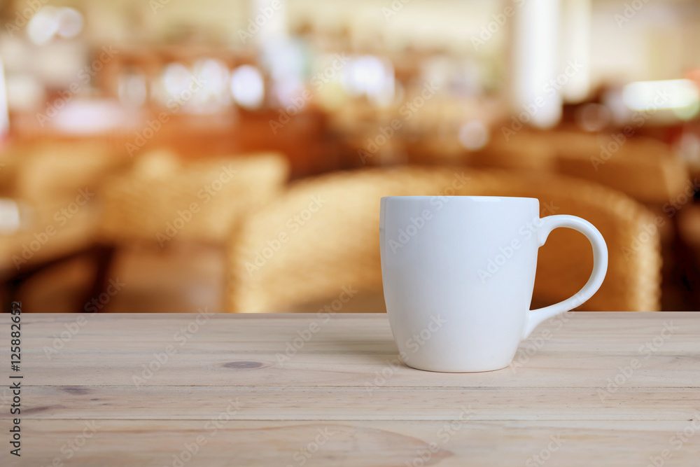 Cup of coffee on a wooden table. Cup of coffee on a wooden table.
