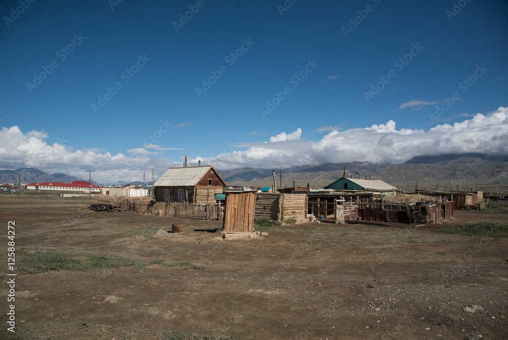 Altai village in the desert and sky with clouds in summer Altai village in the desert and sky with clouds in summer