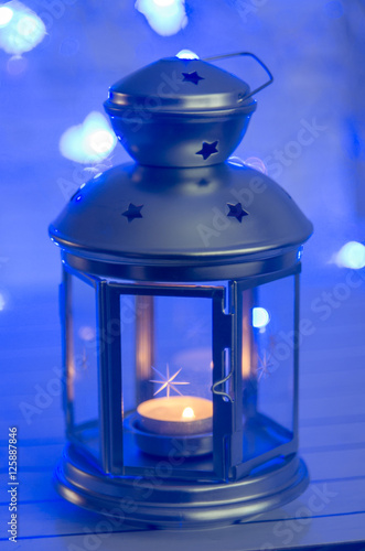 Christmas lantern with candle. Bokeh