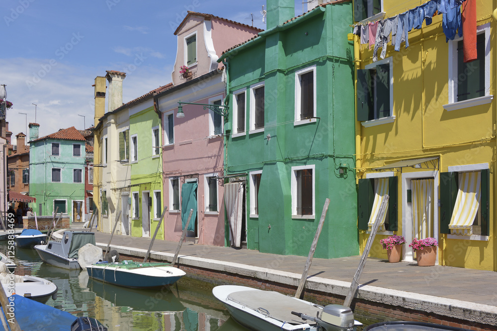 Burano with its canal and boats. Burano is an island in the Venetian Lagoon, northern Italy