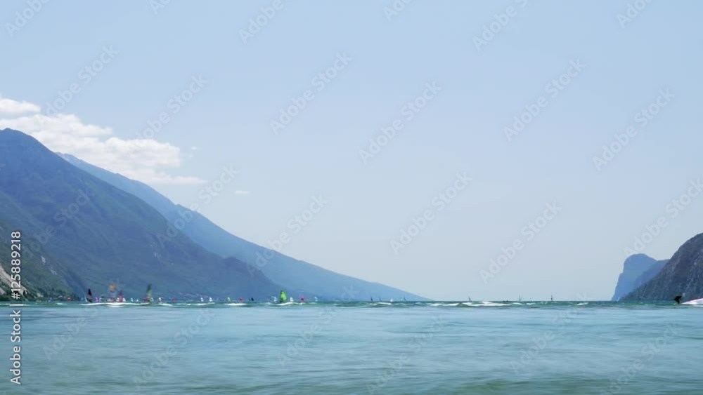 Timelapse video with windsurfers sailing on strong wind and waves Timelapse video with windsurfers sailing on strong wind and waves