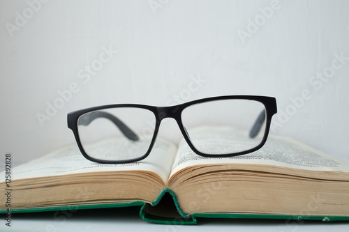 Glasses lying on the book