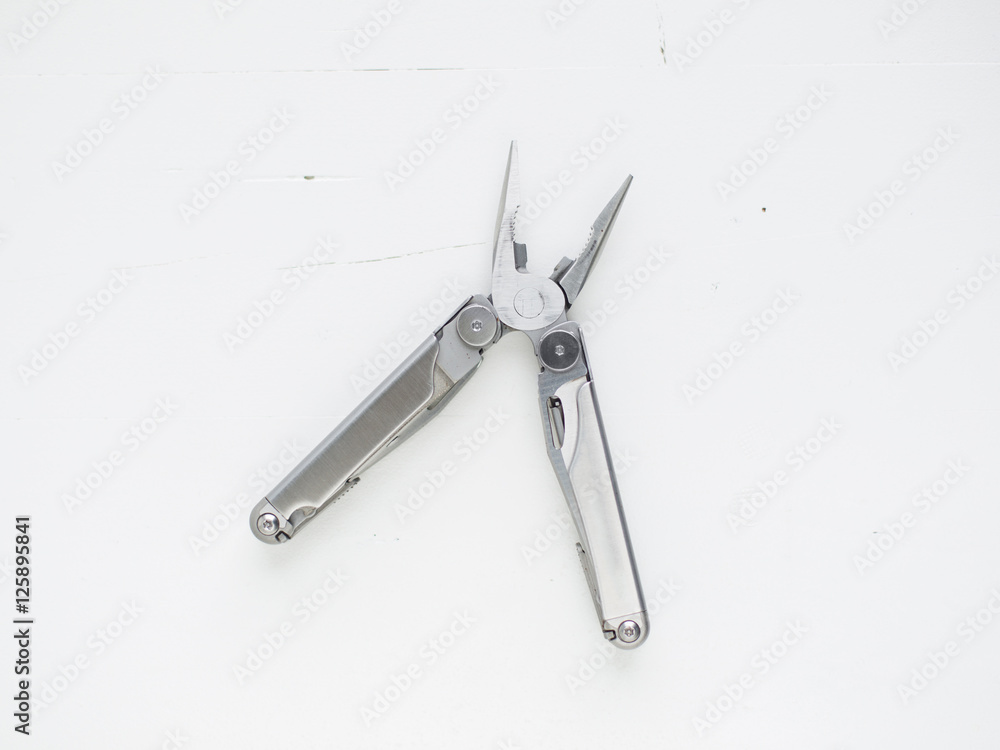 Multi-tool pilers on white background Multi-tool pilers on white background
