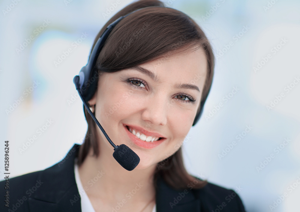 Happy young woman working at callcenter, using headset Happy young woman working at callcenter, using headset