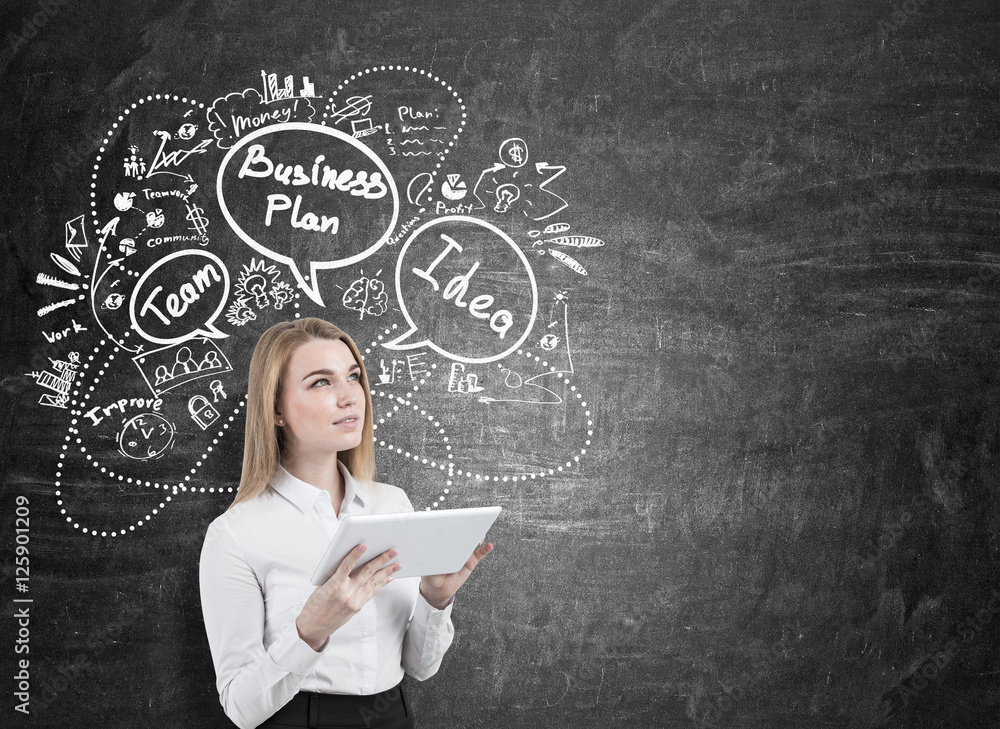 Cheerful woman with tablet and business sketch Cheerful woman with tablet and business sketch