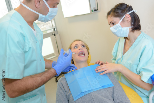 Nervous dental patient about to be injected