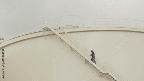 large white tank for petrol and oil