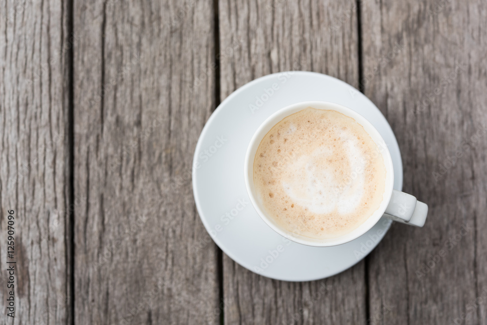 Cup of coffee on grunge wooden background Cup of coffee on grunge wooden background