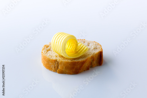 Butter curl on a slice of  bread