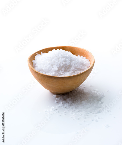 Sea Salt in a wooden bowl on white background
