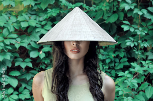 Portrait of a girl in a straw hat