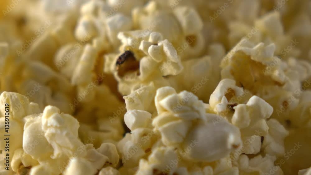 Rotating paper box of popcorn. 4K macro clip Rotating paper box of popcorn. 4K macro clip