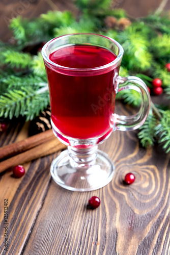 Glass cup with christmas hot punch for winter Cinnamon berrry wine Copy space