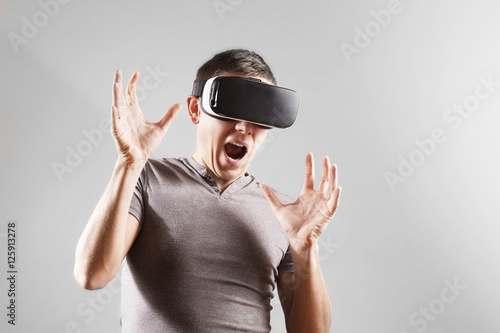 Young man in virtual reality, vr glasses.