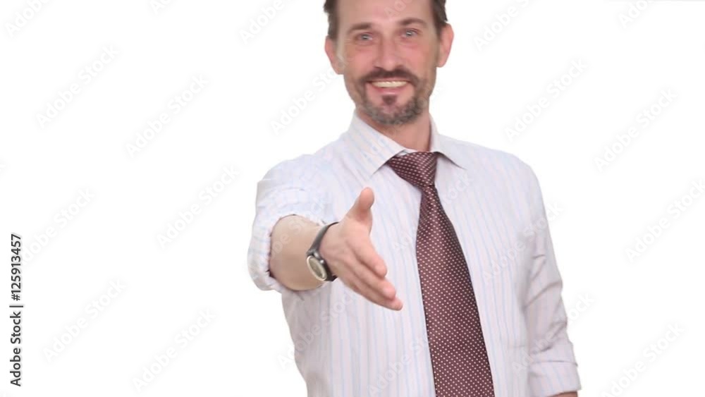 happy confident and executive businessman smiling, coming to camera and giving hand to have handshaking. Prosperous man of middle age working as director or head of company, enterprise or firm. happy confident and executive businessman smiling, coming to camera and giving hand to have handshaking. Prosperous man of middle age working as director or head of company, enterprise or firm.