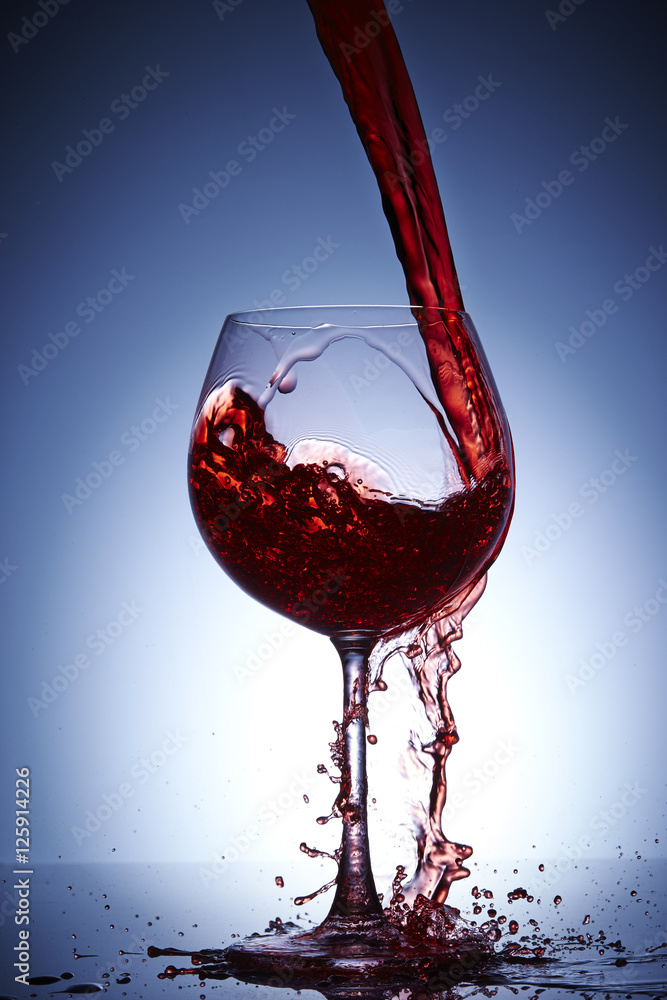 Fototapeta premium Pouring wine into glass
