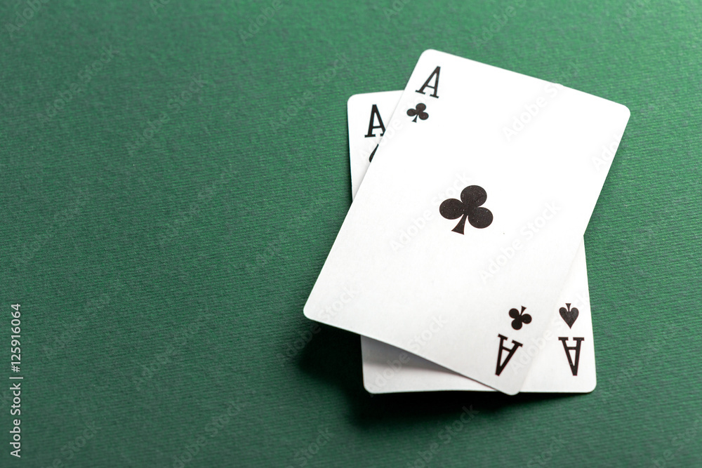 Cards and chips for poker on green table Cards and chips for poker on green table