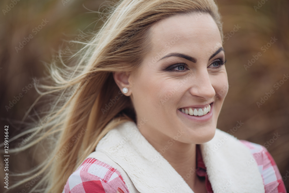 Happy blonde woman smiling outdoor Happy blonde woman smiling outdoor