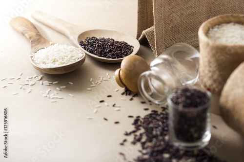 Mixed rice and Rice berry or uncooked brown rice in wooden spoon