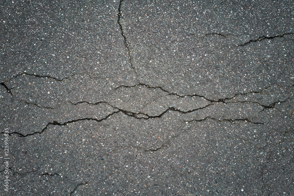 Obraz premium cracked gray asphalt background