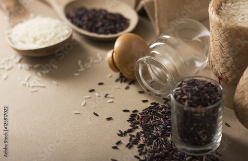 Mixed rice and Rice berry or uncooked brown rice in wooden spoon