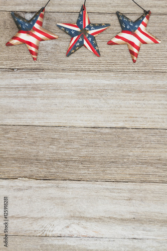USA patriotic old flag on a stars and weathered wood background
