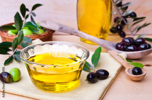 Olive oild and fresh olives photo