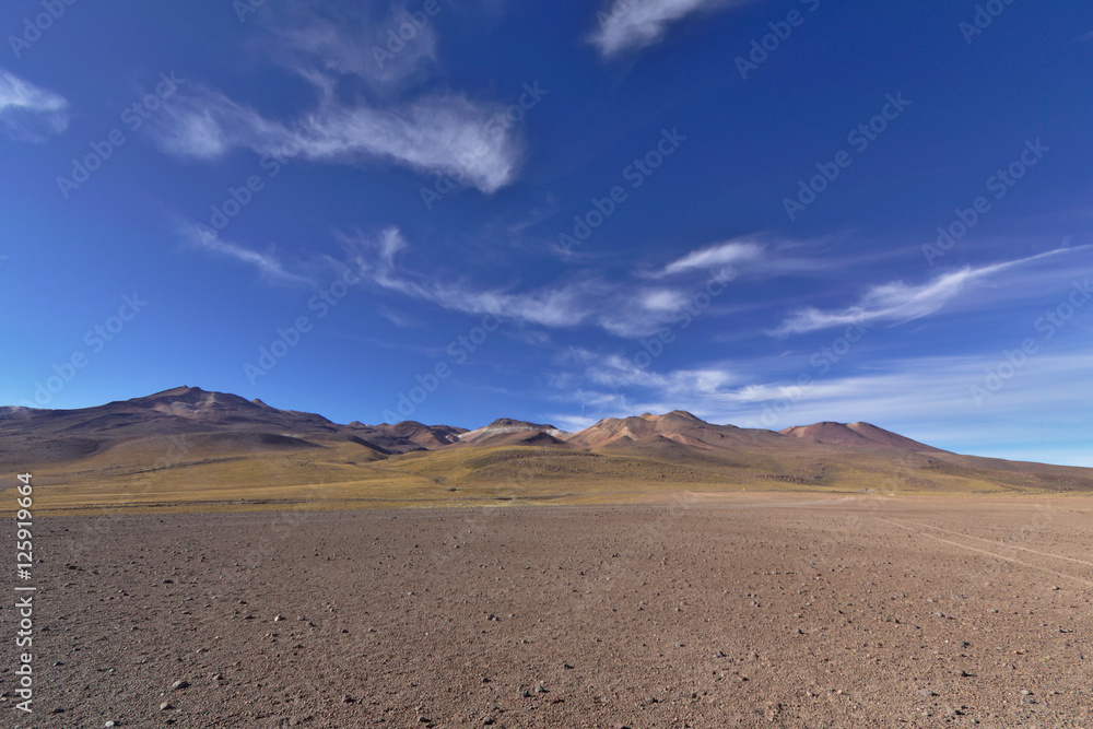 Marvelous desert scenery with volcanic mountains under a gorgeou