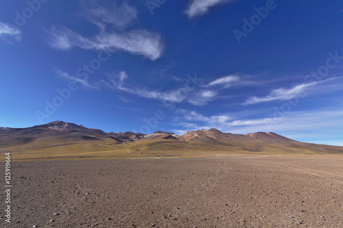 Marvelous desert scenery with volcanic mountains under a gorgeou