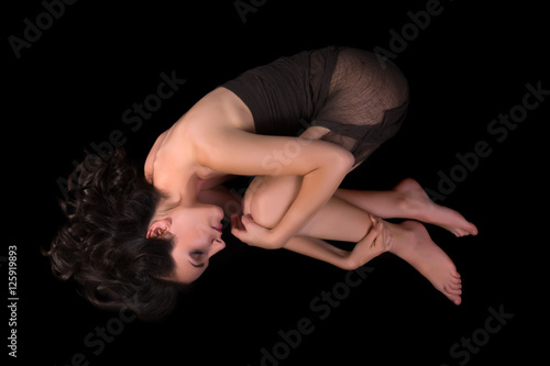 Woman curled up on the floor