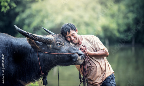 Bild auf Leinwand Asian farmer and water buffalo in farm