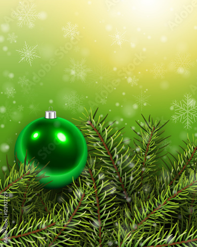 Christmas background green with fir branches and glass ball