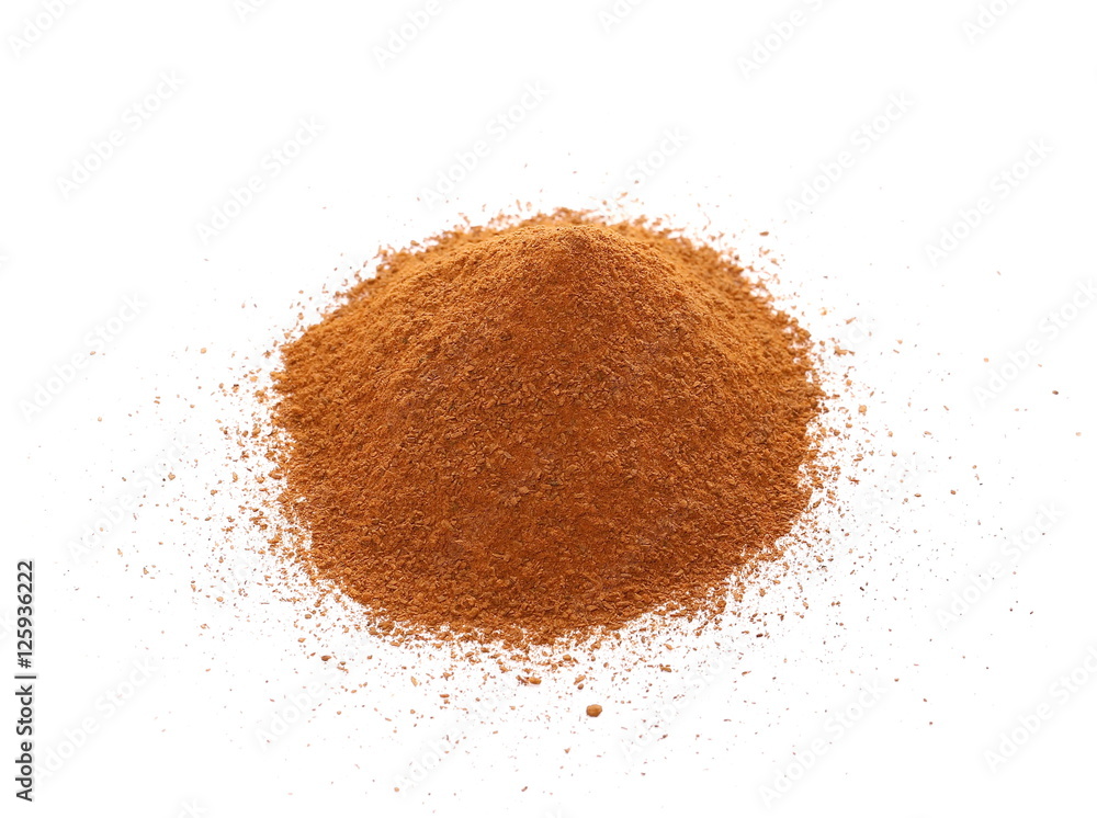 Heap of ground Cinnamon isolated on white Heap of ground Cinnamon isolated on white