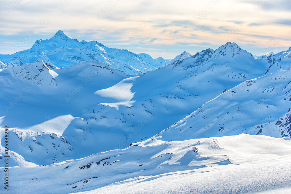 Snowy blue mountains in clouds Snowy blue mountains in clouds