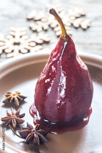 Merlot-poached pear on the plate