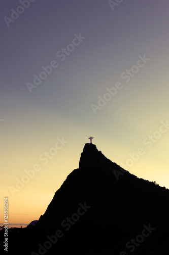 Christ the Redeemer Statue on top of Corcovado hill in the evening sunlight  Rio de Janeiro  Brazil.