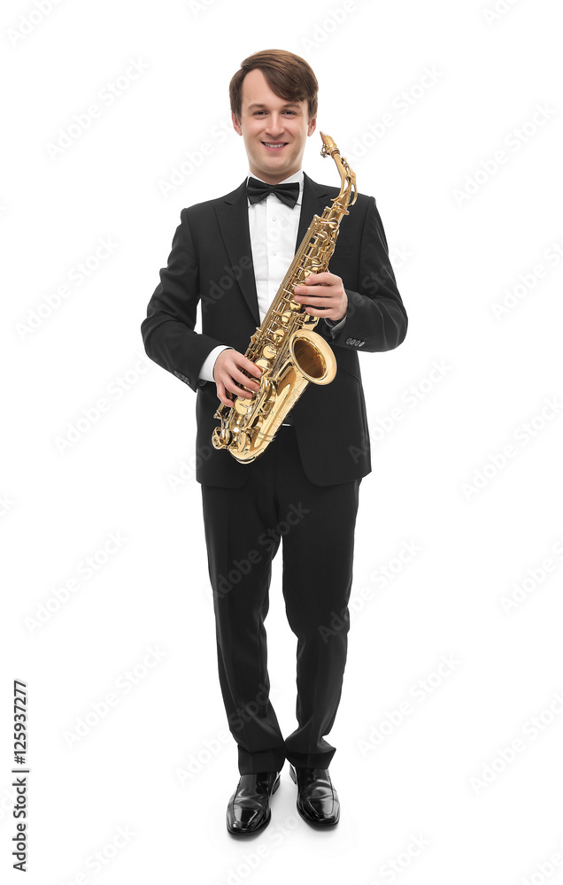 Fototapeta premium Attractive saxophonist with a saxophone in a suit.