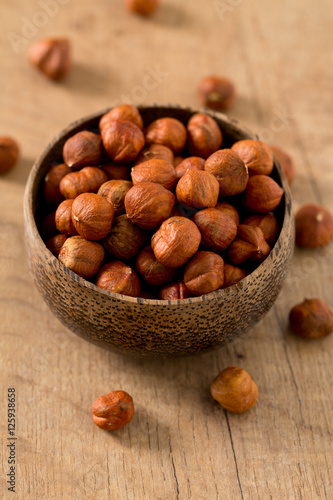 hazelnuts on wooden surface