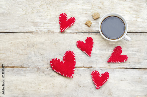 Toy hearts and a cup of coffee