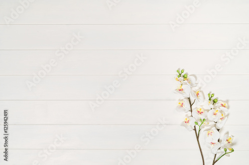 Woman's table, desk or workspace seen from above. Top view background with white wood and copy space