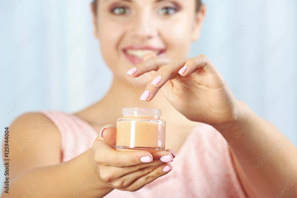 Jar of cream in female hands, close up Jar of cream in female hands, close up