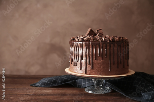 Tasty chocolate cake on table photo