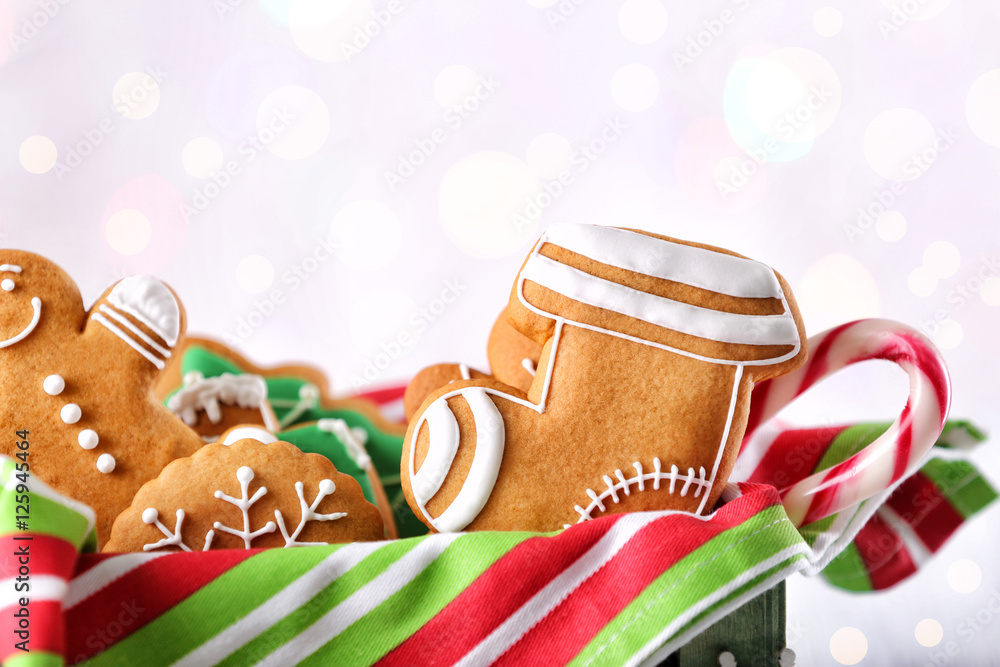Box with tasty Christmas cookies on light background, close up view Box with tasty Christmas cookies on light background, close up view