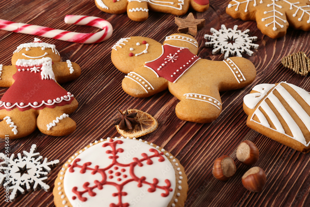 Tasty Christmas cookies and decor on wooden table, close up view