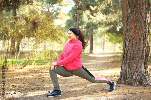Sporty young woman training...