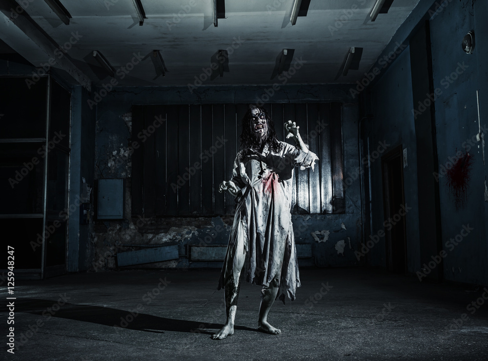 Fototapeta premium Portrait of the horror zombie woman. Halloween.